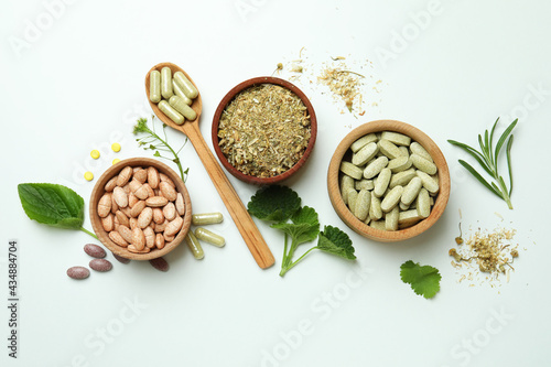 Canvastavla Concept of herbal medicine pills on white background