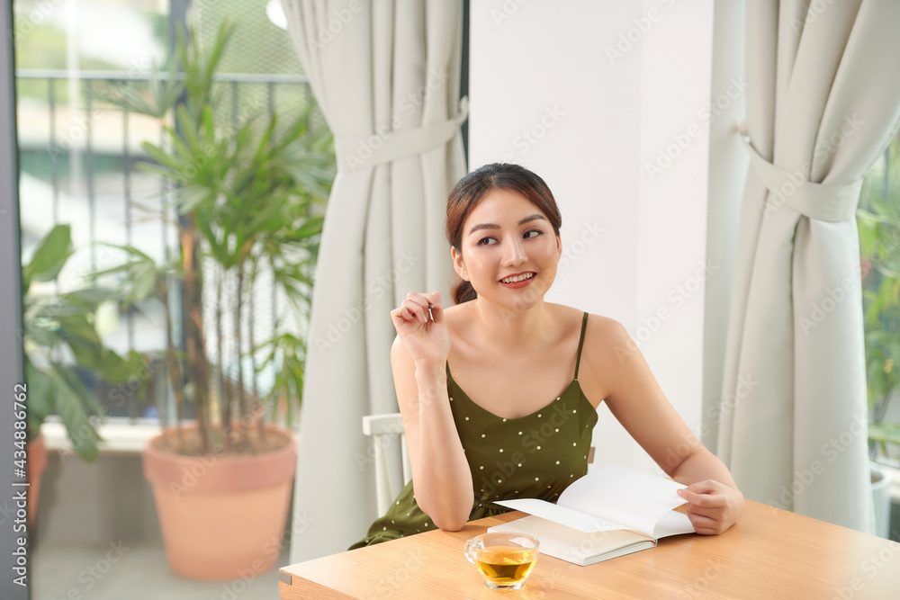 beautiful woman drinking tea in the morning sitting by the window beautiful woman drinking tea in the morning sitting by the window