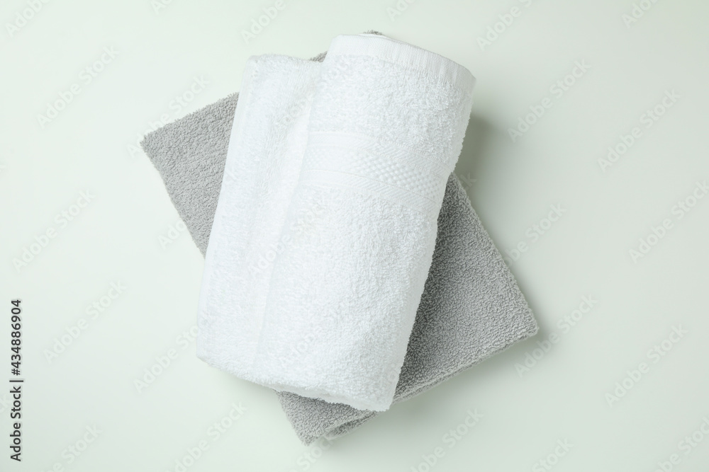Fototapeta premium Clean folded towels on white background, top view
