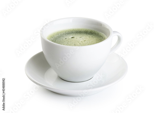 Green matcha tea in a cup isolated on a white background.