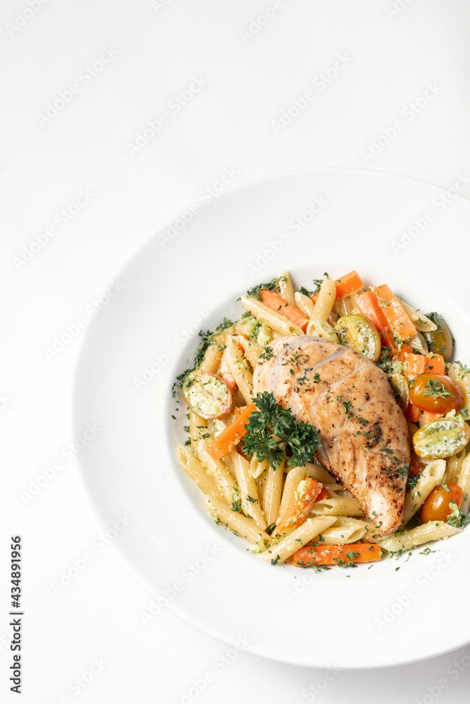 fried chicken breast with penne and saute vegetables pasta dish fried chicken breast with penne and saute vegetables pasta dish