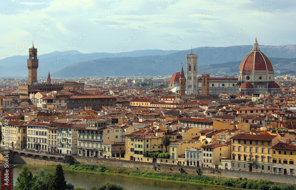 Florence in region of Tuscany in Italy with the great Duomo and Palazzo Vecchio seen from Piazzale Michelangelo on the hill and the Arno river