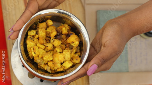 hands holding bowl of cereal