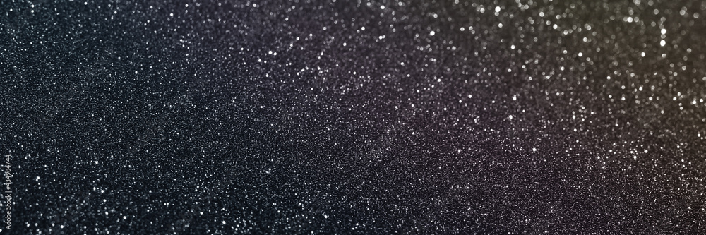 Black glitter bokeh circle glow blurred and blur abstract. Glittering shimmer bright luxury . White and silver glisten twinkle for texture wallpaper and background backdrop.
