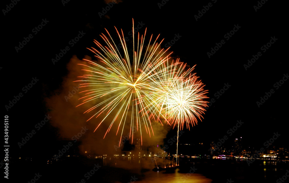 Spectacular fireworks exploding in to the night sky over the bay