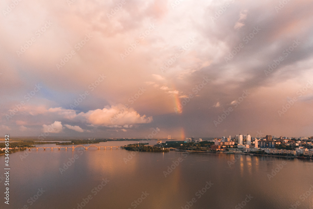 Rainbow is double in the most of photo. Beautiful double rainbow in the city after the rain. Photos taken from the drone