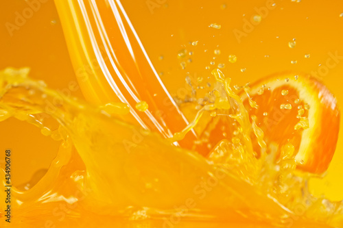 Pouring orange juice splash...