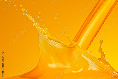 Pouring orange juice splash...
