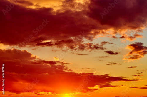 background of red dramatic beautiful sunset over the city © Temir