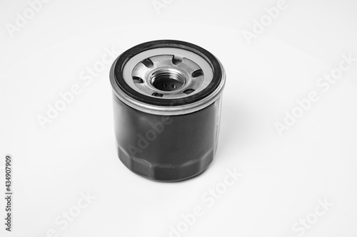 Car engine oil filter on a white background. Auto parts store. Auto repair shop