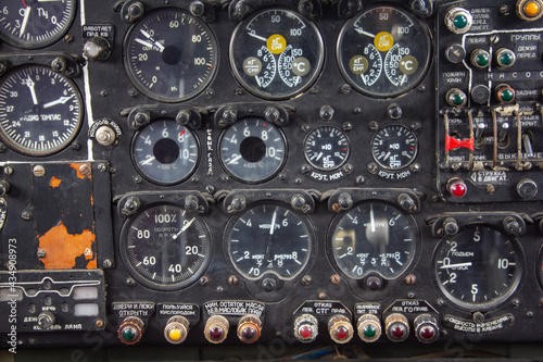 The dashboard of an old plane. Instruments and switches in the cockpit of an old plane