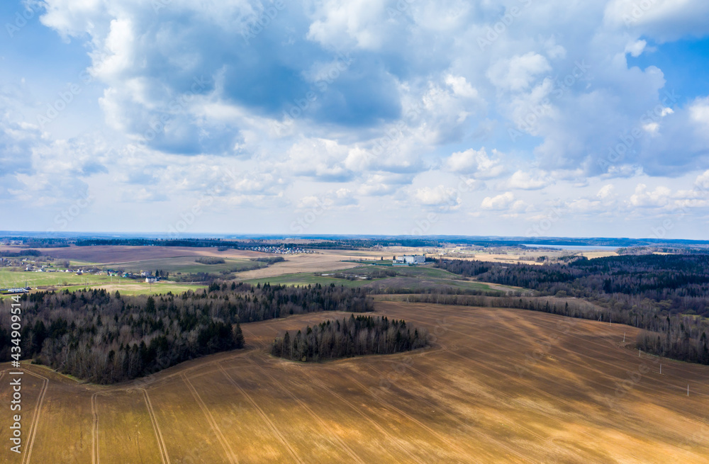 Aerial view of agricultural landscape with fields in spring season. Aerial view of agricultural landscape with fields in spring season.