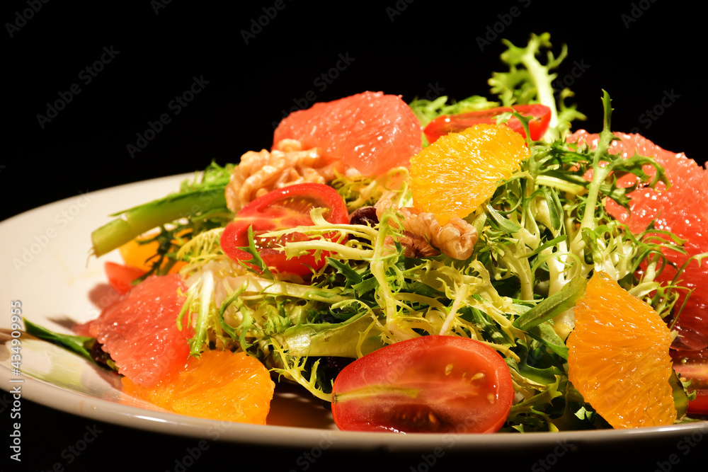 Salad of different ingredients shot close up and with black background Salad of different ingredients shot close up and with black background