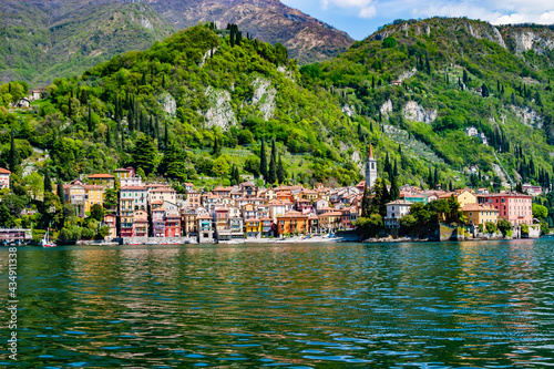 If you travel from Lugano to Lake Como the first village that you find is Menagio.. There you can take the ferry to Varenna.