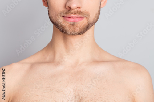 Photo of pretty charming young guy neck no clothes smiling isolated grey color background
