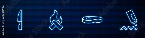 Set line Steak meat, Barbecue knife, Campfire and Sauce bottle. Glowing neon icon on brick wall. Vector