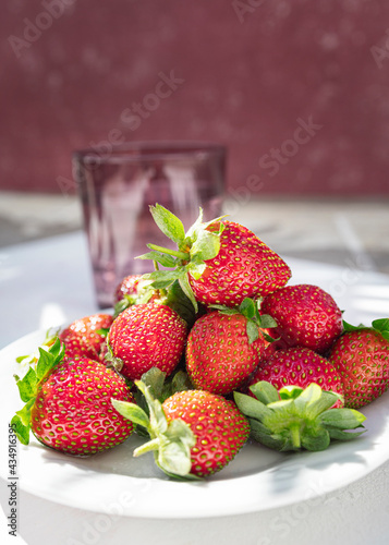 Wild and organic strawberries. Dishes with fresh strawberries. Fruit photography