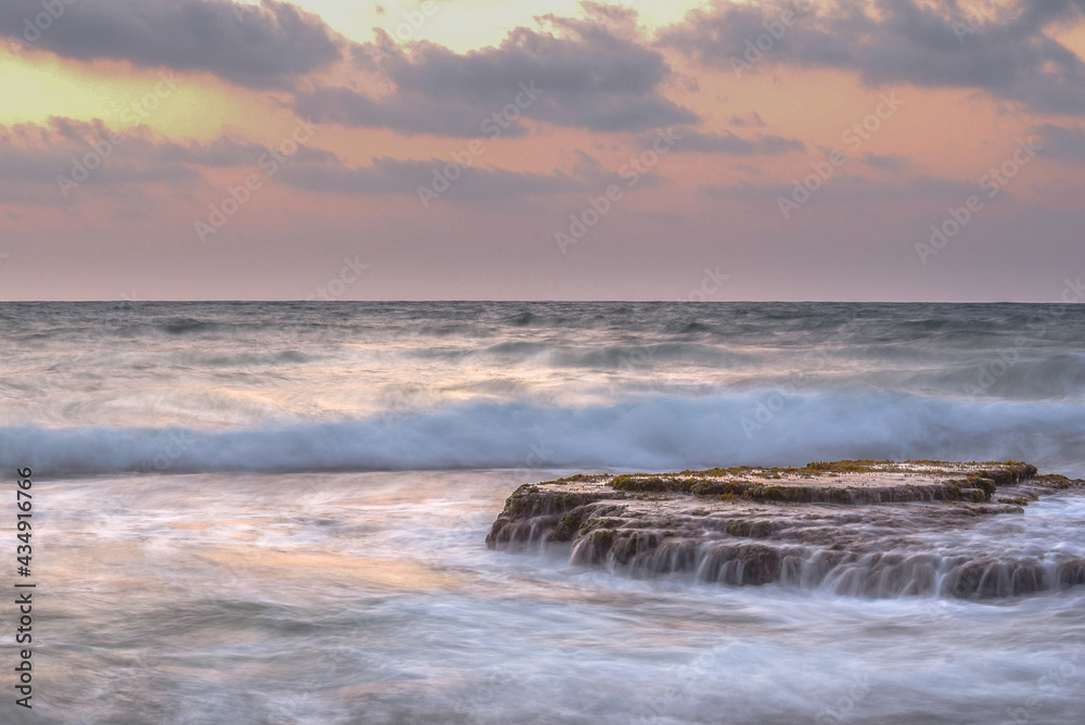 Long exposure picture of a beautiful Mediterranean Sea sunset at the coastline near Haifa, Israel