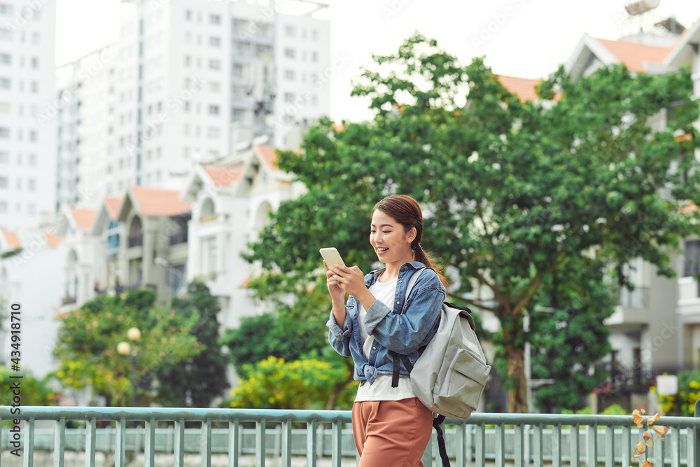Woman use of mobile phone look for destination Woman use of mobile phone look for destination