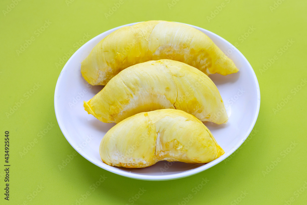 Fresh ripe durian in white plate on white Fresh ripe durian in white plate on white