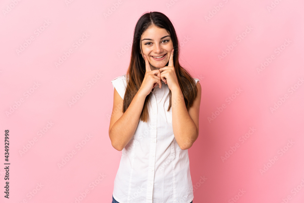 Young caucasian woman isolated on pink background smiling with a happy and pleasant expression Young caucasian woman isolated on pink background smiling with a happy and pleasant expression