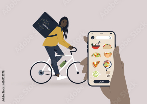 Take away food delivery service, a young female Black courier riding a bike