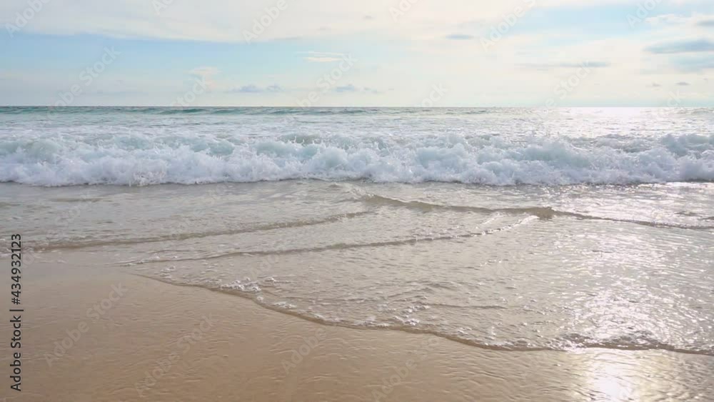 Slow motion shot Close up of wave crashing on the tropical beach in sunny day and wave moving towards camera Hand held shot of Sea waves