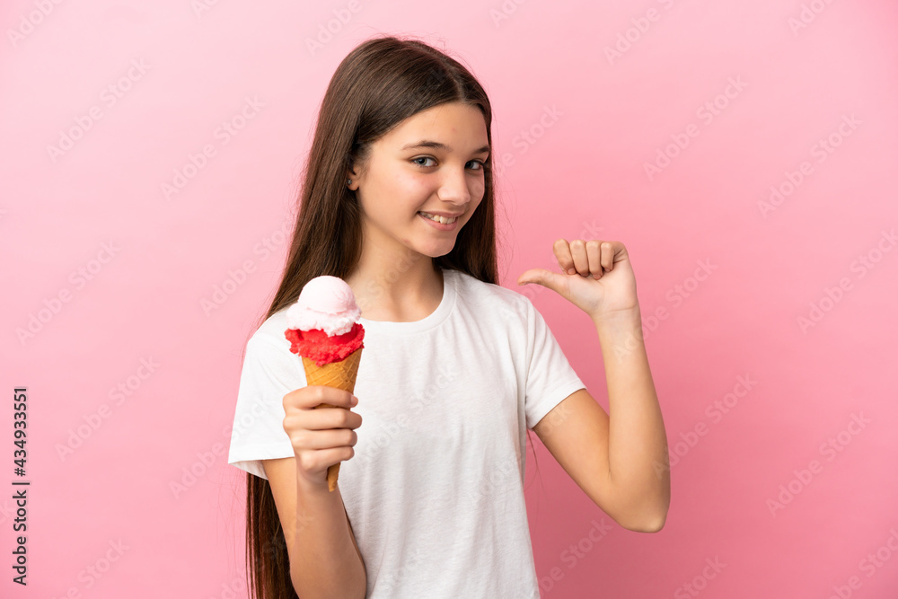 Little girl with a cornet ice cream over isolated pink background proud and self-satisfied Little girl with a cornet ice cream over isolated pink background proud and self-satisfied