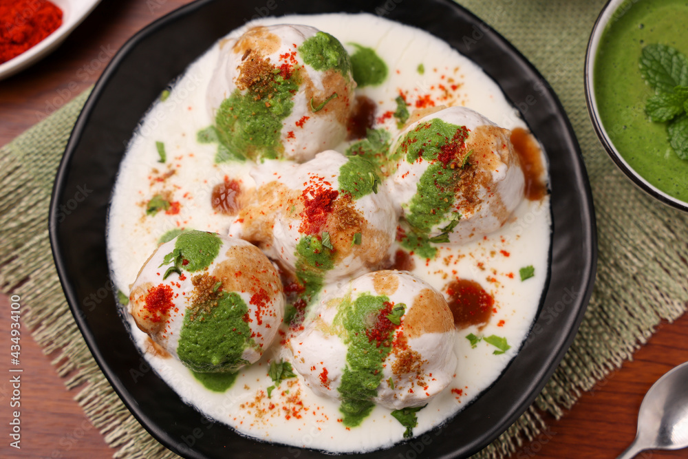 Indian street food Dahi vada Dahi Bhalla with green chutney, tamarind chutney chaat appetizer thayir vadai curd vada soaked in yogurt. North Indian snack Delhi Mumbai India, sri Lanka ,Pakistani food Indian street food Dahi vada Dahi Bhalla with green chutney, tamarind chutney chaat appetizer thayir vadai curd vada soaked in yogurt. North Indian snack Delhi Mumbai India, sri Lanka ,Pakistani food