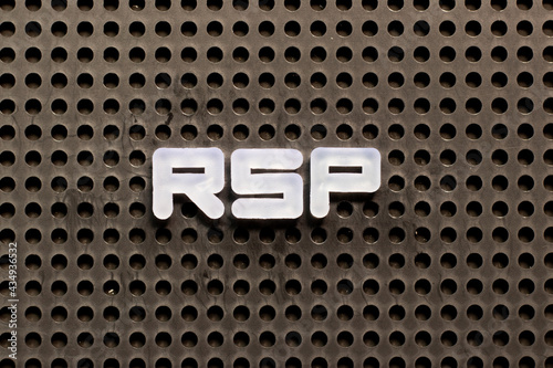 White color letter in word RSP (Abbreviation of Retail  selling price, Retirement savings plan or Research and sponsored programs) on black pegboard background photo