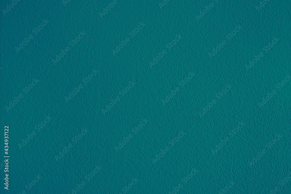 Blue green textured background surface.  Horizontal dark teal backdrop.  Plain cyan blank template, plain wallpaper, copy space.