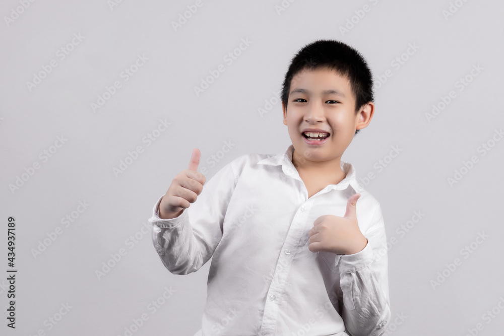 Asian boys studio portrait on gray background Asian boys studio portrait on gray background
