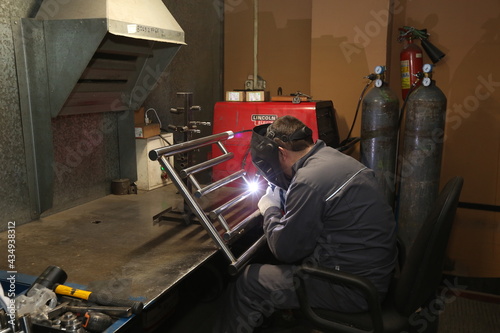 Work as a welder in a factory