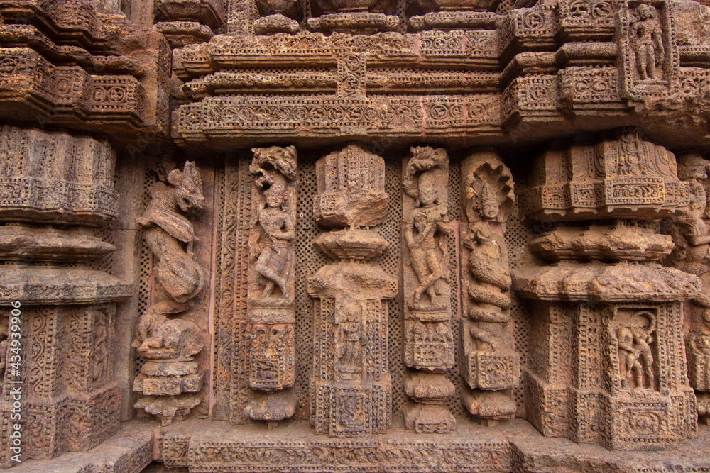 Ancient sandstone carvings on the walls of the ancient Indian temple of 13th century Konark. Ancient sandstone carvings on the walls of the ancient Indian temple of 13th century Konark.