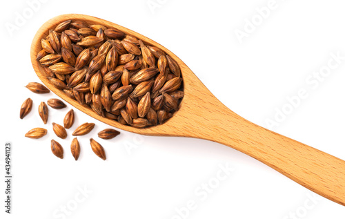 Barley Tea in the wooden spoon, isolated on white background, top view