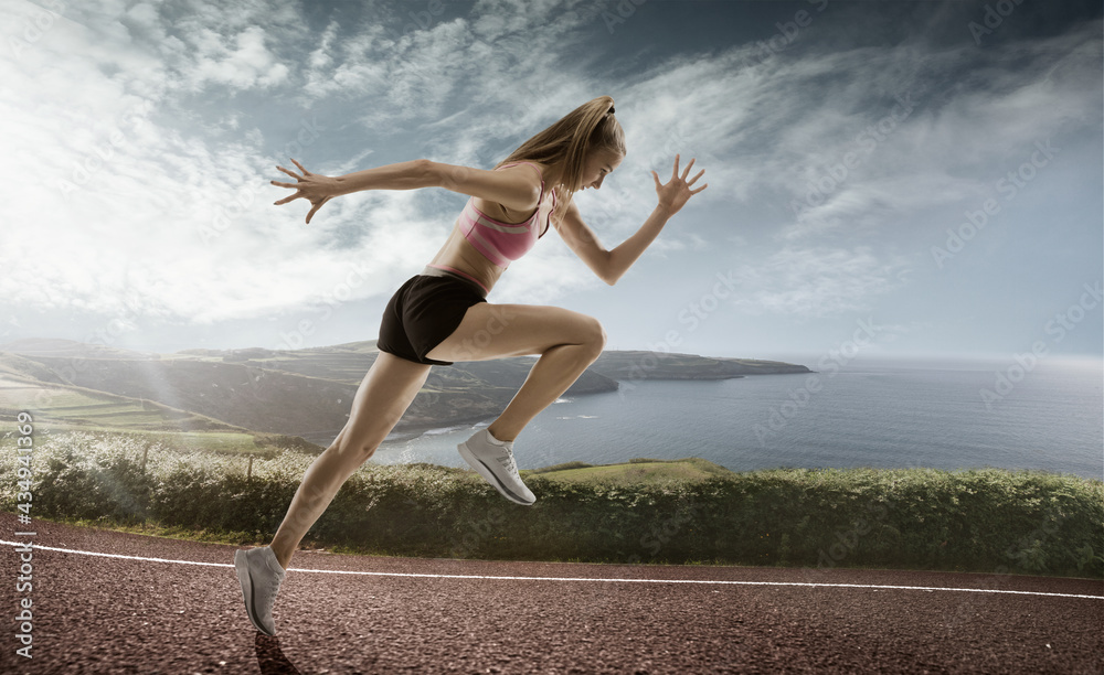 Professional female runner, jogger on road and sky background. Caucasian fit athlete practicing, training excited Professional female runner, jogger on road and sky background. Caucasian fit athlete practicing, training excited