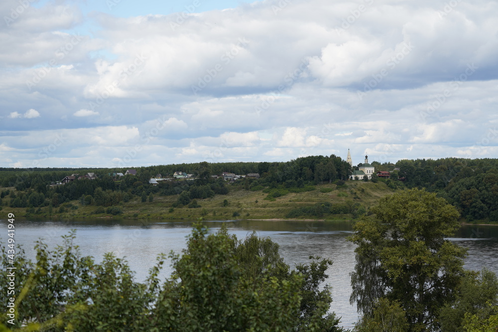 distant Churches on green banks , Golden Ring Russia