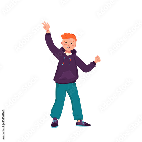 A boy with red curly hair in a jacket, jeans and sneakers smiles. Happy child is dancing. Teenager with a face in casual clothes. World International children day © Екатерина Полякова