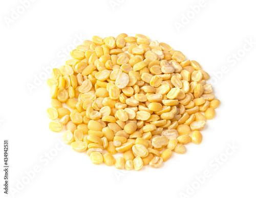 pile of raw moong dal beans closeup on white photo