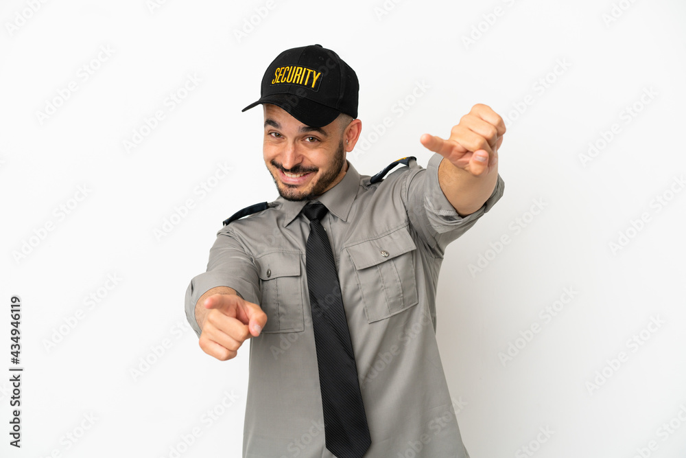 Young security caucasian man isolated on white background points finger at you while smiling Young security caucasian man isolated on white background points finger at you while smiling