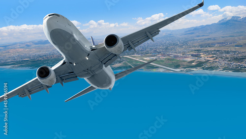 Airplane taking off from airport - Passenger airplane is flying over amazing mountains and sea - Travel by air transport