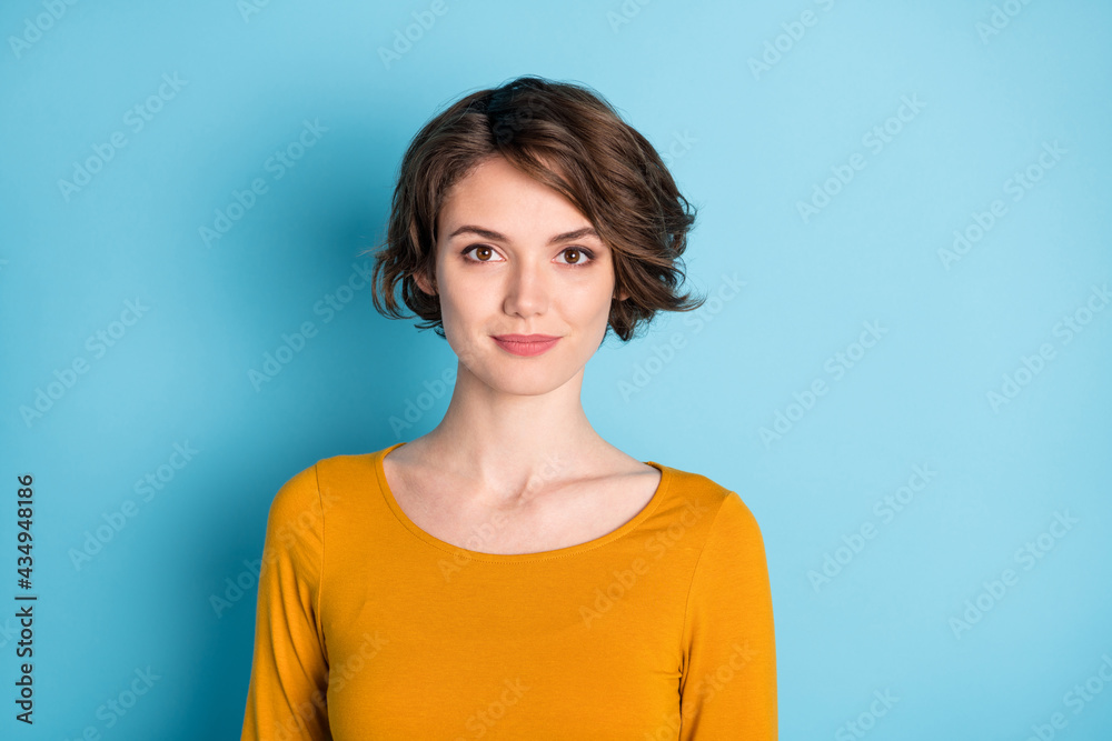 Portrait of optimistic nice brunette short hairdo lady wear brown shirt isolated on bright blue color background Portrait of optimistic nice brunette short hairdo lady wear brown shirt isolated on bright blue color background