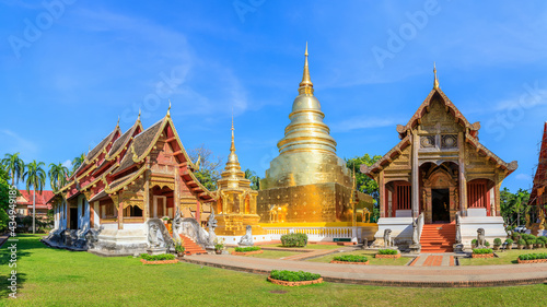 Chapel and golden pagoda at Wat Phra Singh Woramahawihan, famous travel destination in Chiang Mai, panorama