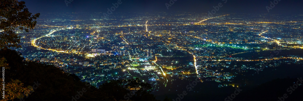 Fototapeta premium Chiang Mai city cityscape aerial view skyline during night with illuminated light, panorama.