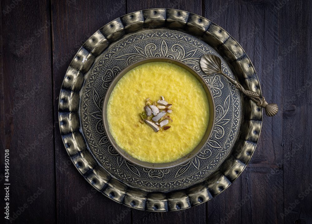 mango-flavored Phirni served in traditional plates mango-flavored Phirni served in traditional plates
