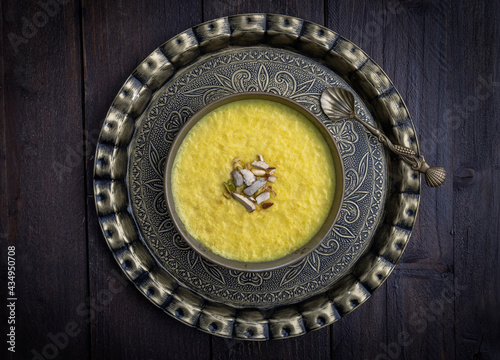 mango-flavored Phirni served in traditional plates