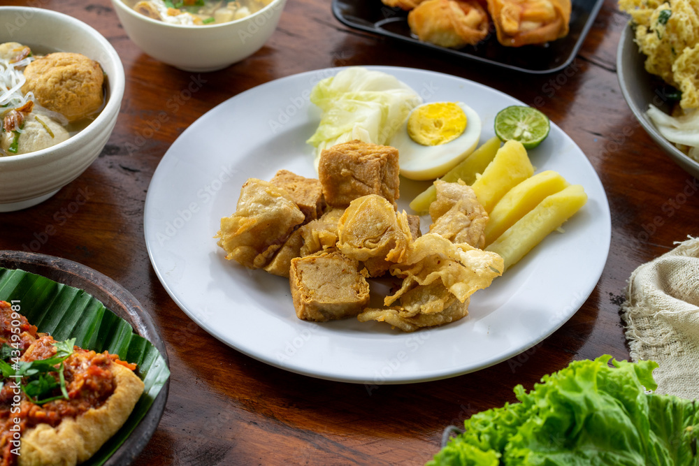 Indonesian specialities made from tofu are served on the table. Indonesian specialities made from tofu are served on the table.