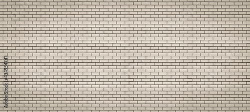 Obraz na plátně Long brick wall made of beige refractory bricks