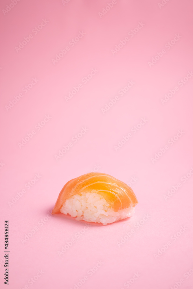 Sushi salmon on pink background