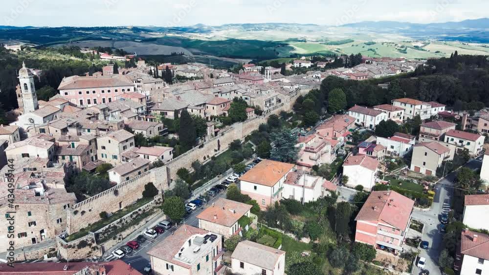 Amazing aerial view of San Quirico medieval town in Tuscany. Slow motion Amazing aerial view of San Quirico medieval town in Tuscany. Slow motion